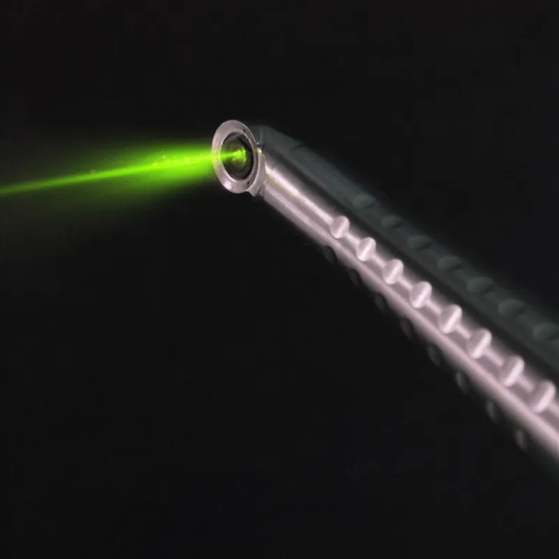 A close, dramatic view of the Fotona laser's targeting beam