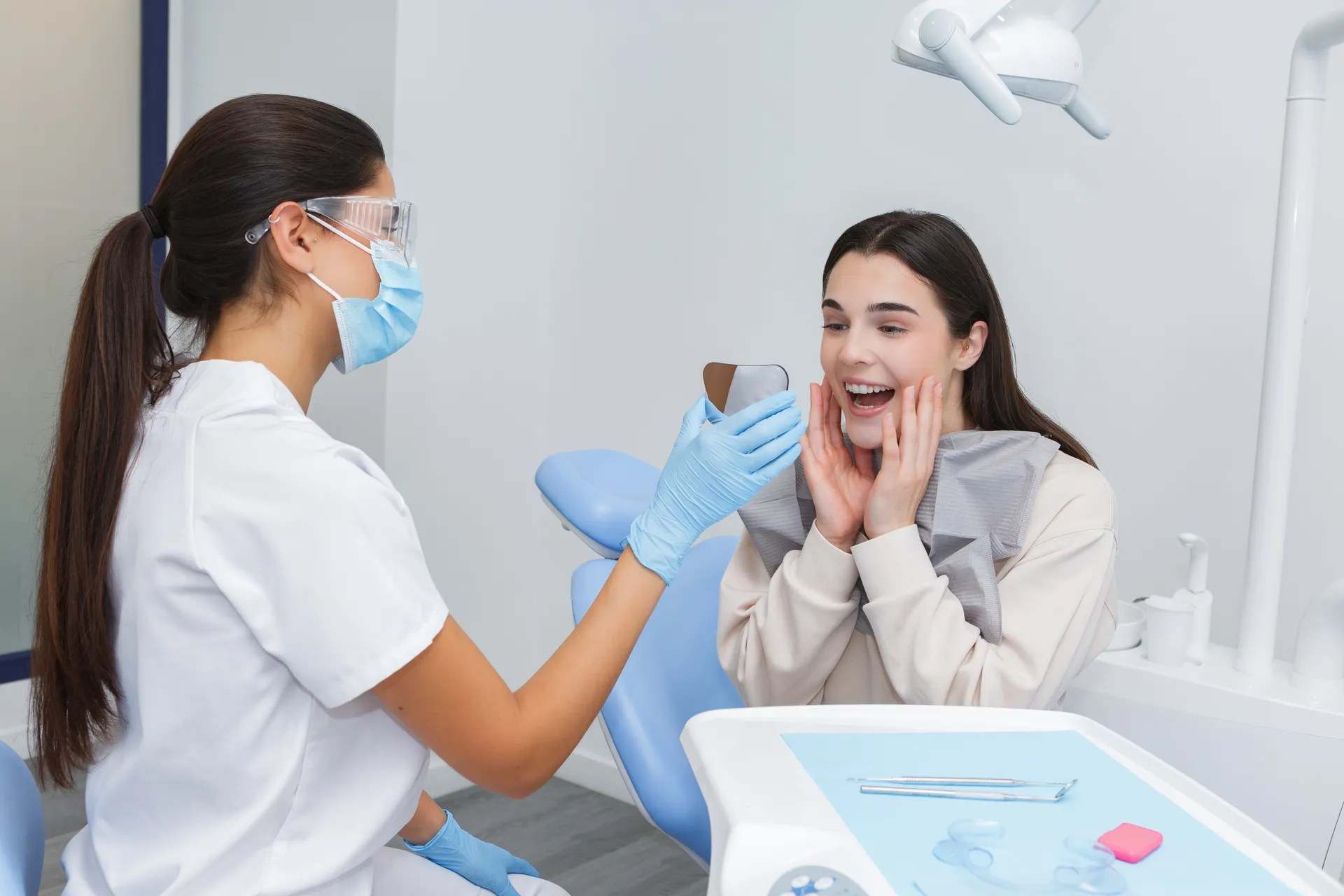 A dentist showing a patient her results and scan during an appointment