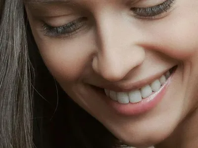 Close-up portrait of a young woman with a soft smile