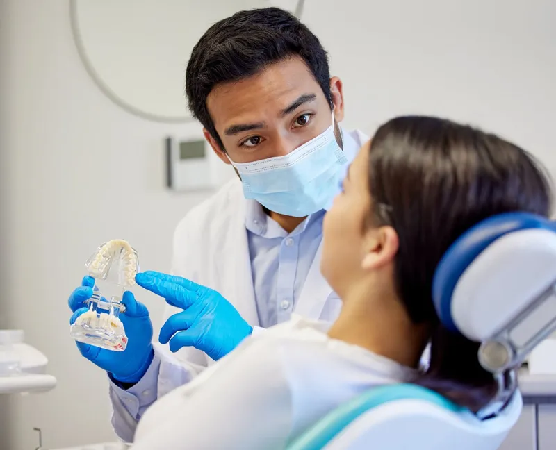 A dentist explaining a treatment plan to a patient in the clinic