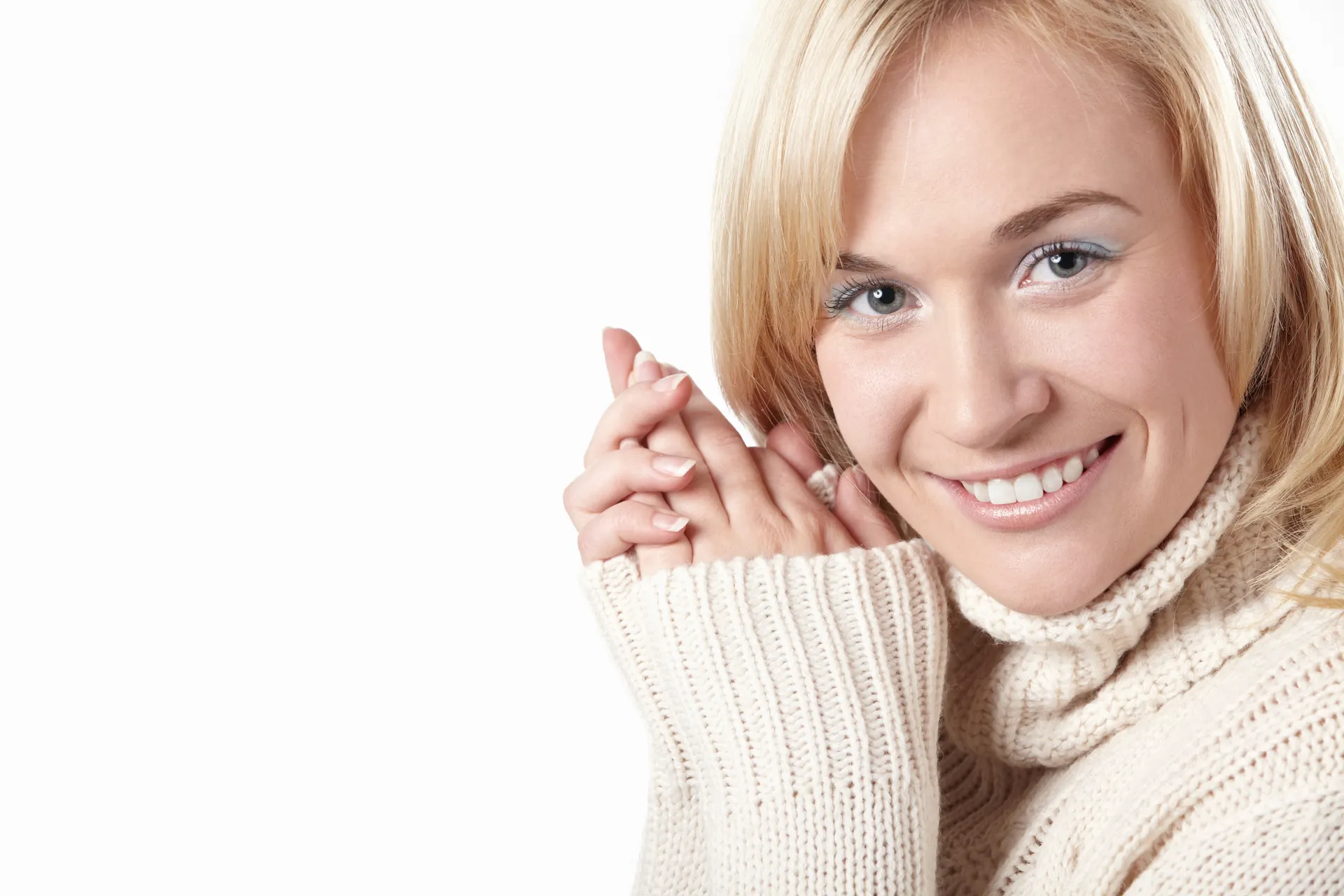 A person smiling warmly and naturally