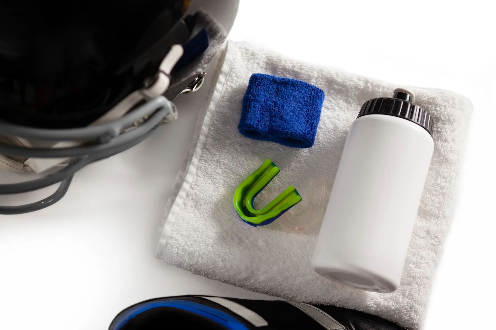 Sports mouthguard alongside athletic equipment
