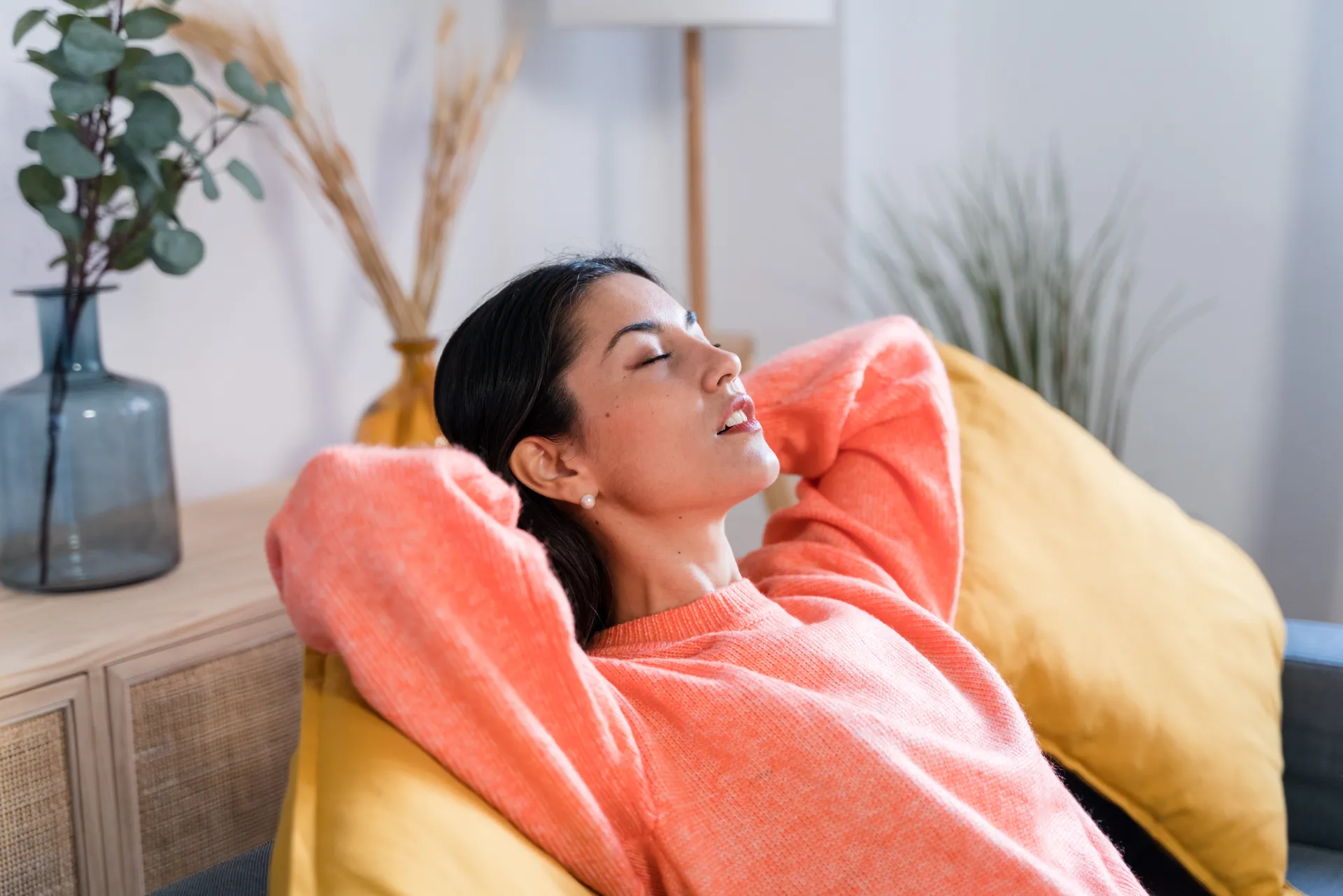 A woman resting peacefully, feeling calm and at ease